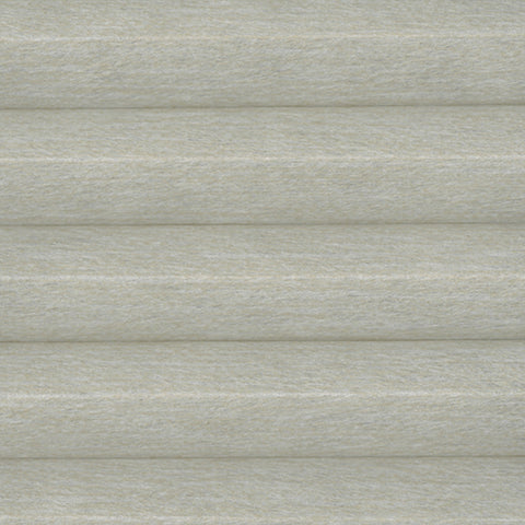 Fresco Light Filtering Natural Calico honeycomb fabric close up from a Bi-Fold pleated Blind. A neutral coloured thermal efficient Cellular Blind.