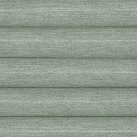 Close-up a Honeycomb Pleated Bi-Fold door Blind with Fresco Blackout Moss Green, a textured green fabric. This Cellular Blind features Blackout and thermal efficiency. 